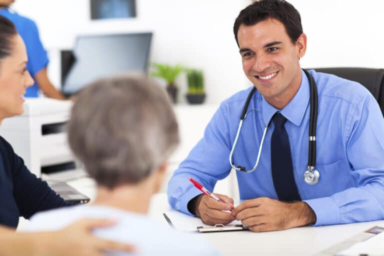 patient sitting with a doctor