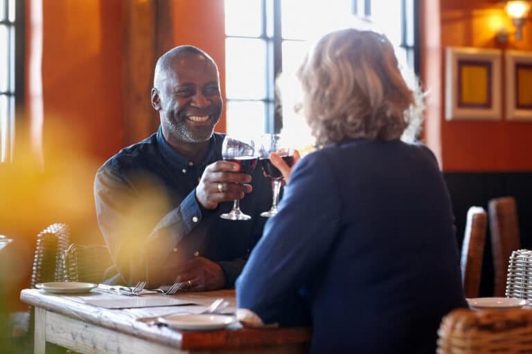 Happy senior couple on a date at a nice restaurant.