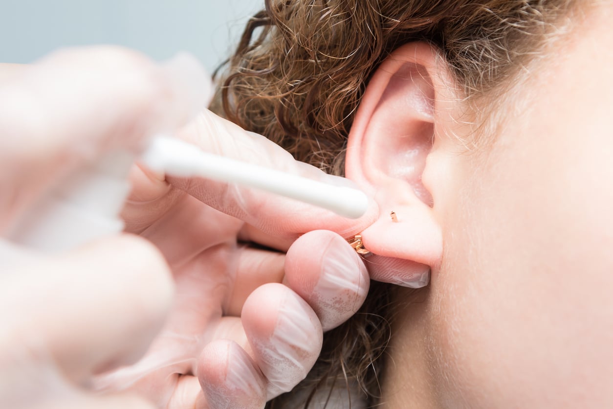 Person gets ear piercing