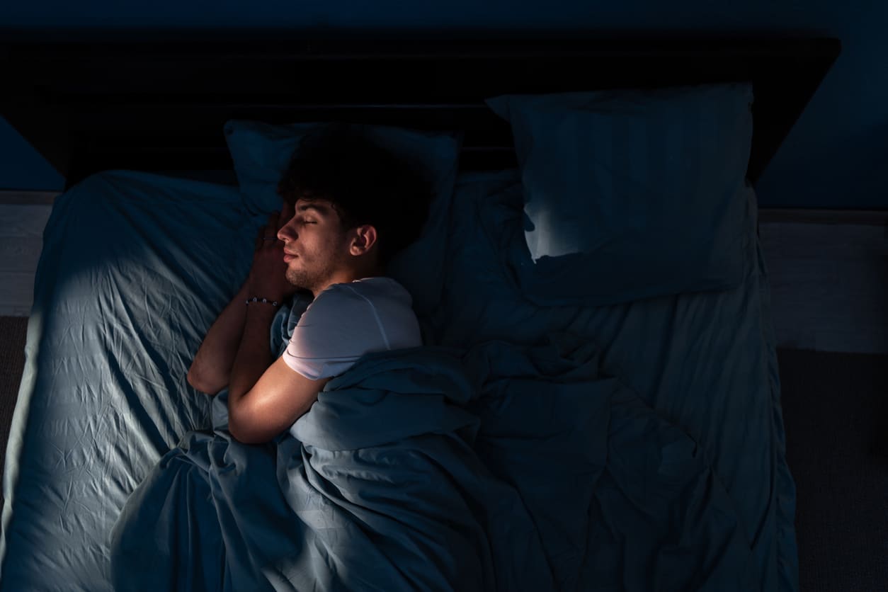 Man Sleeping in Bed